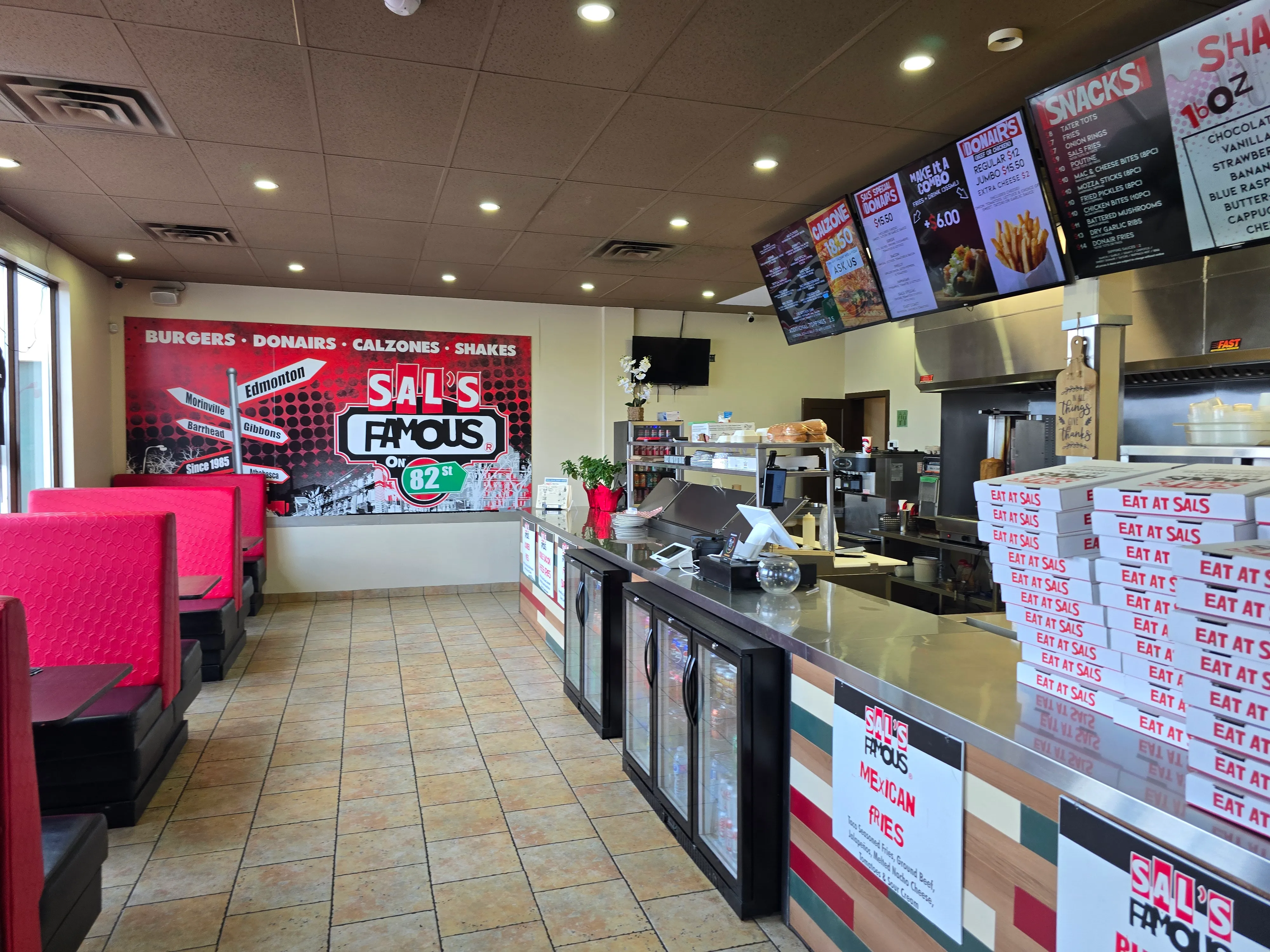 Front counter and menu boards inside Sal's Famous on 82 St Edmonton