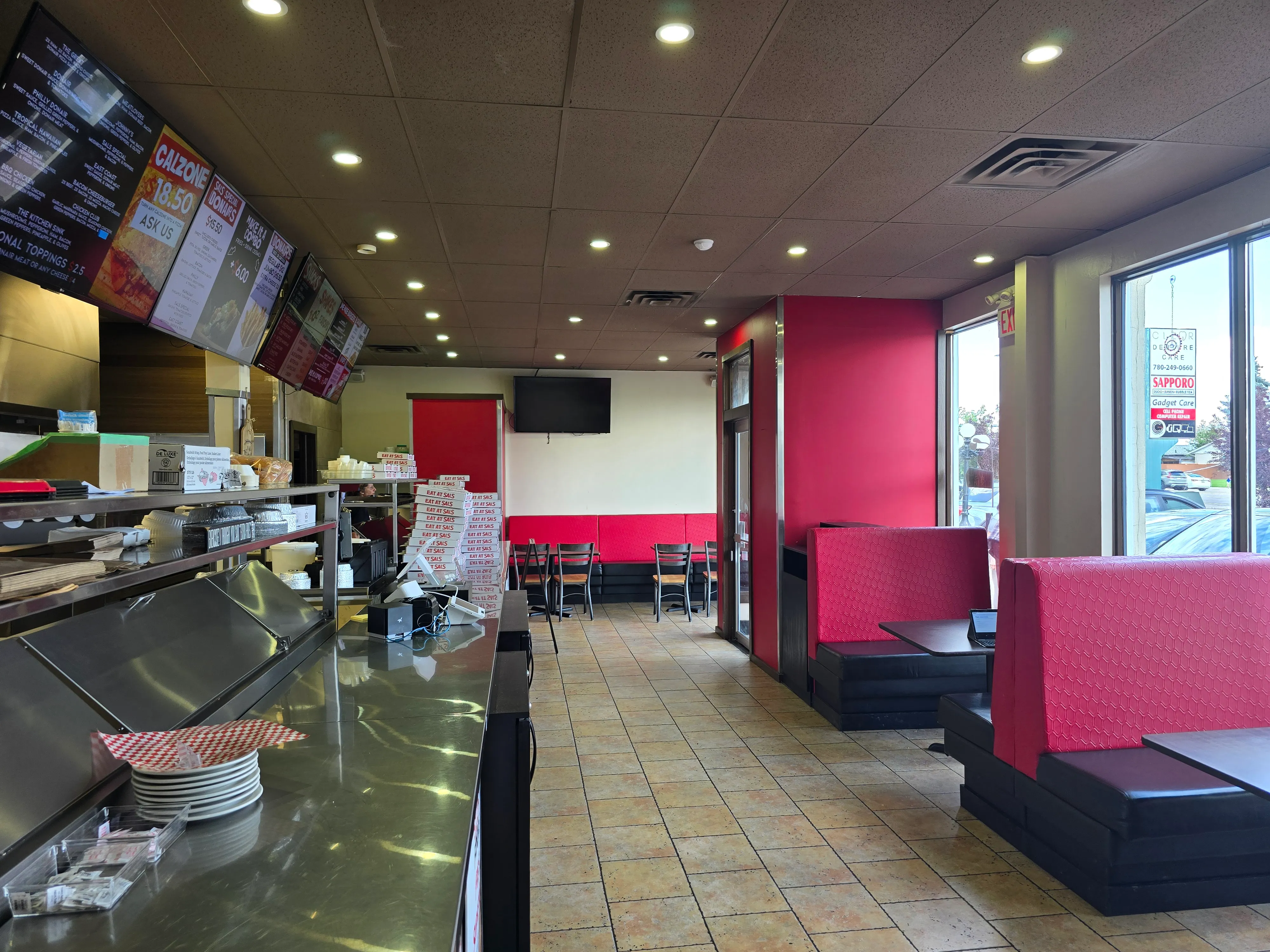 Dining room with booth seating at Sal's Famous on 82 St Edmonton